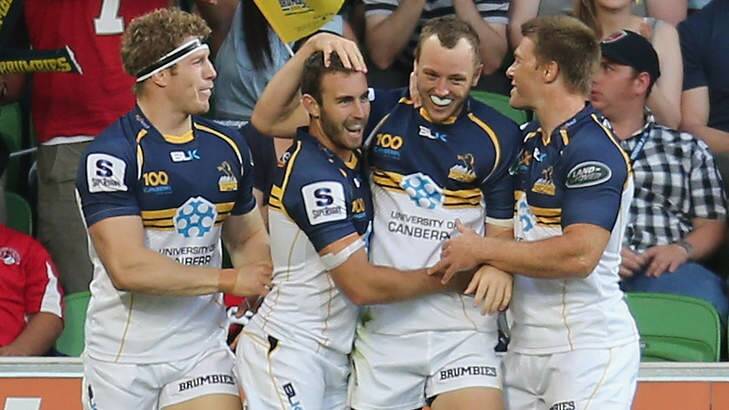 The Brumbies celebrate their sixth-straight win on the road. Photo: Scott Barbour