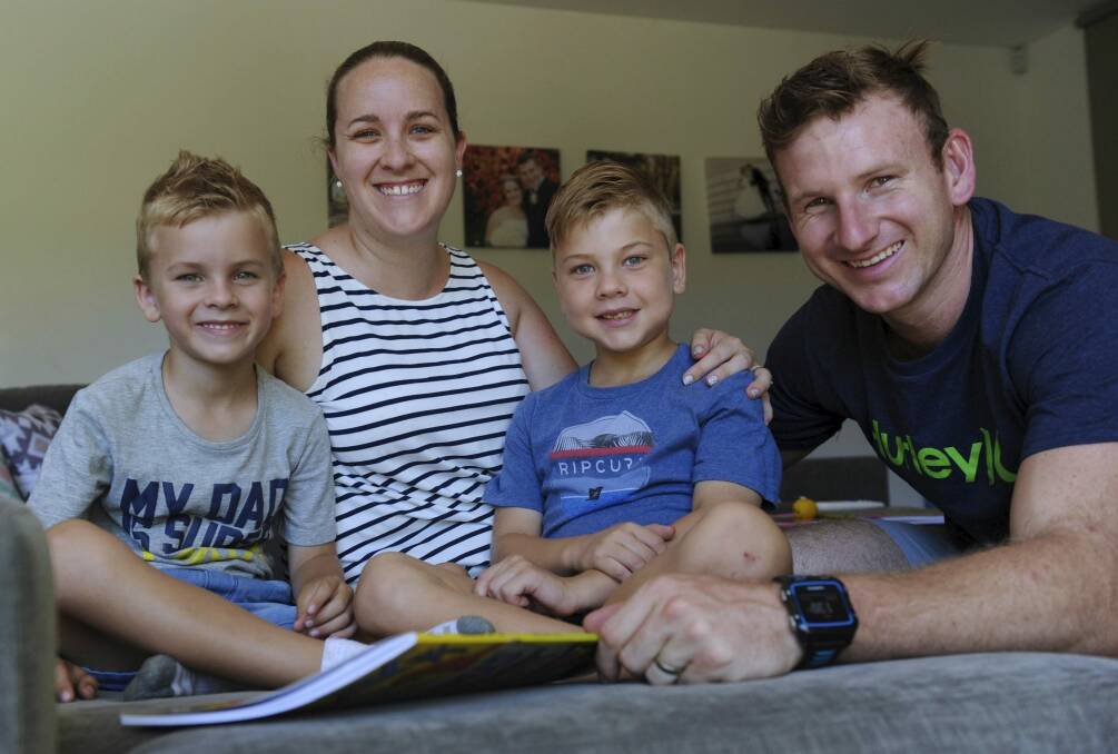 Brendan Irvine (right) will compete in his first long course marathon to celebrate one-year since he donated a kidney to son Harry, 8, (second from right) while son Cooper, 5 and wife Lauren cheer him on. Photo: Graham Tidy