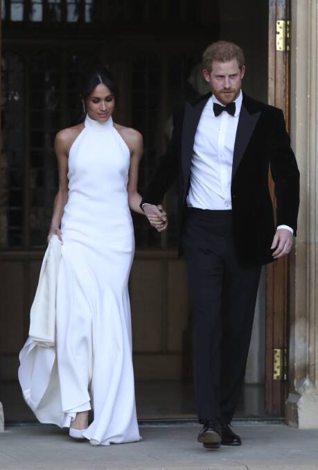 The Duke and Duchess of Sussex leave their  lunch reception .  Photo: Press Association