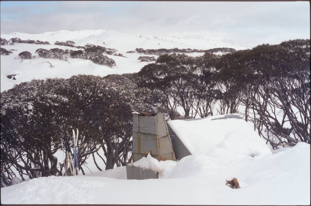 Tin Hut, one of several back-country huts in Kosciuszko National Park that are sometimes half-buried in snow. Photo: Matthew Higgins