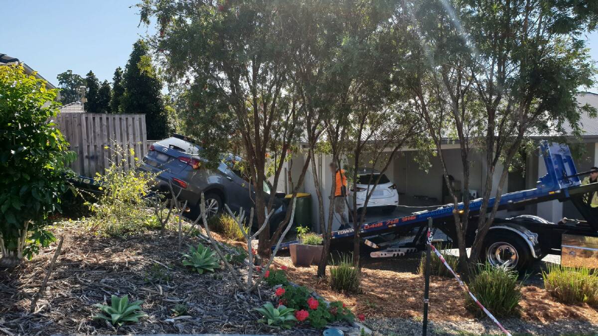 A car crashed into a house in Upper Coomera on Monday morning. Photo: Queensland Ambulance Service