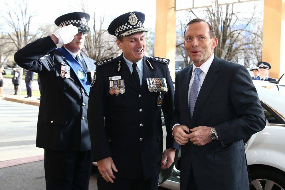 AFP Commissioner Tony Negus with Prime Minister Tony Abbott.  Photo: Alex Ellinghausen