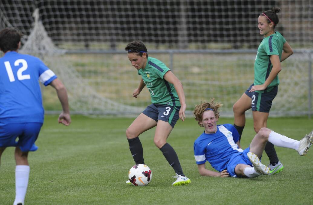 The Matildas have a friendly match with an ACTAS boys team at the AIS. Ashleigh Sykes (3) in action. Photo: Graham Tidy