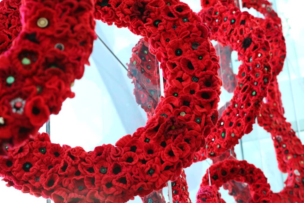 The Canberra Airport work is just a hint of a much larger installation of handcrafted poppies to be installed at the War Memorial. Photo: Supplied