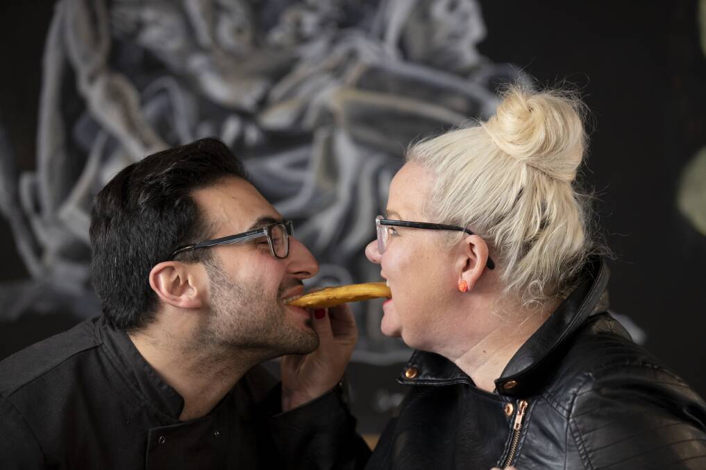 Anthony and I re-enact a scene from 'Lady and the Tramp' with a potato scallop. Photo: Sitthixay Ditthavong