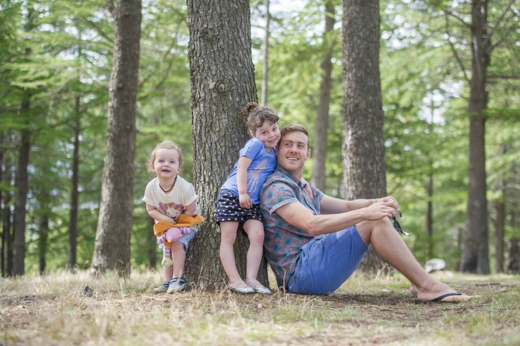 Jason Tolmie with his daughters Neko, 4, and Ada, 2, wearing Foxtrot Threads, a Kickstarter campaign using 100 per cent organic cotton with his own designs for kids' clothing. Photo: Jay Cronan