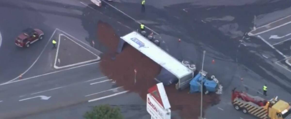 The truck spilled a load of woodchip across the road. Photo: Nine News Brisbane/Twitter
