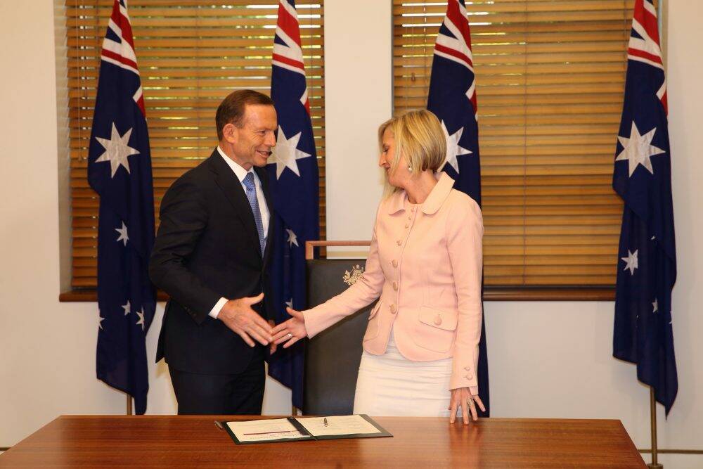 Prime Minister Tony Abbott with ACT Chief Minister Katy Gallagher after signing an Asset Recycling Agreement in Parliament House. Photo: Andrew Meares