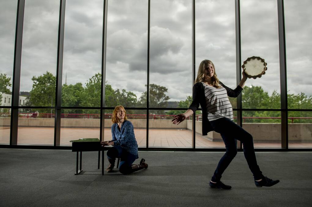 Percussionists Wyana O'Keeffe and Veronica Bailey experiment with toy instruments, which will be used in the Canberra Symphony Orchestra's upcoming concert.
 Photo: Jay Cronan