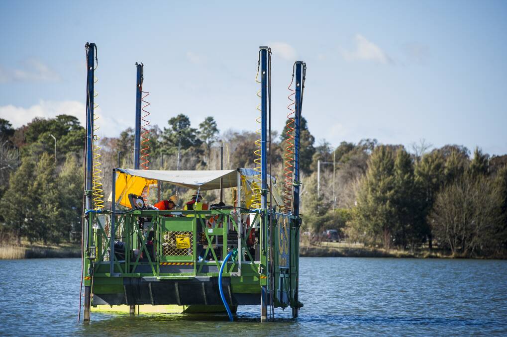 NCA staff testing sediment depth at Lake Burley Griffin from a barge to help with further redevelopment of the park, including the boardwalk. Photo: Elesa Kurtz
