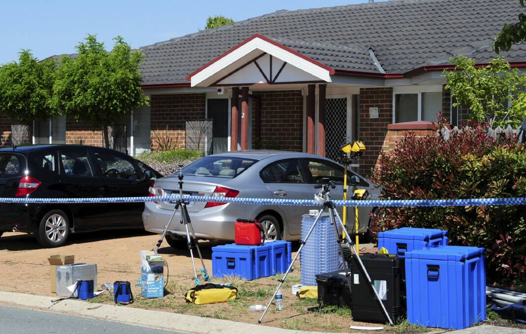 Forensic equipment outside the property on Sunday. Photo: Graham Tidy