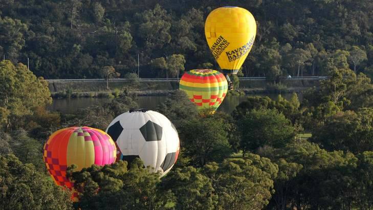 A soccer ball hot air balloon promoting next year's Asian Cup takes to the sky for the Canberra Balloon Spectacular. Photo: Graham Tidy