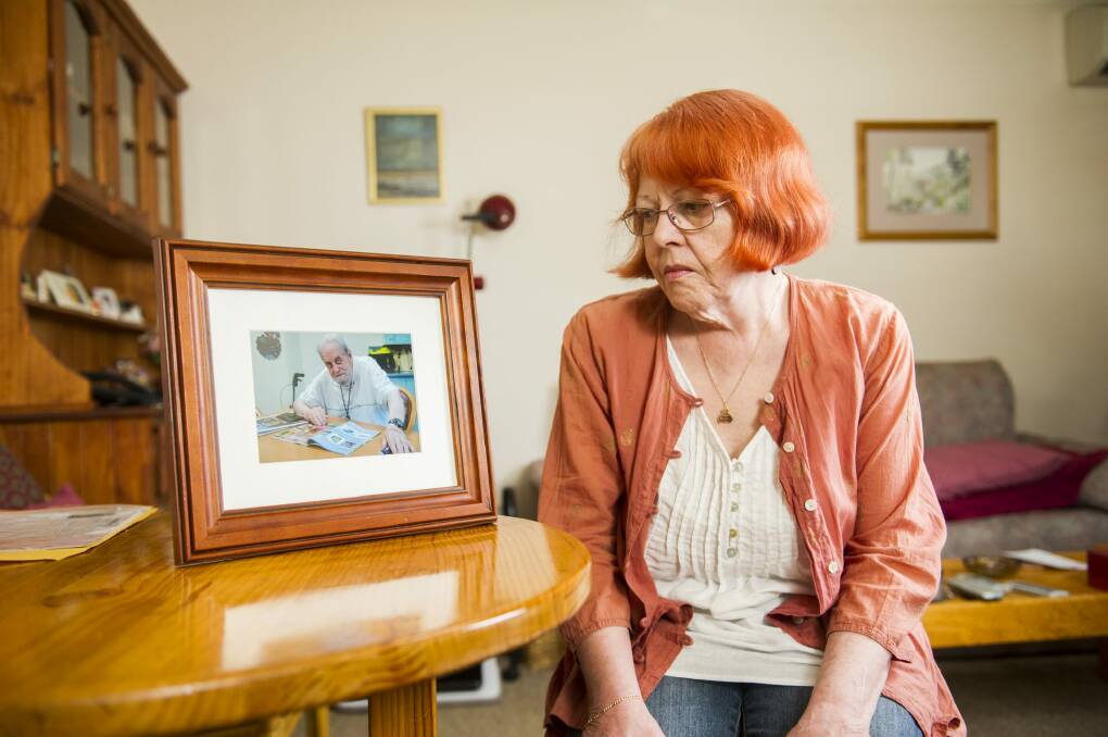Unhappy daughter: Kambah resident Moira Smith looks at a photo of her father Douglas who died recently. Photo: Rohan Thomson