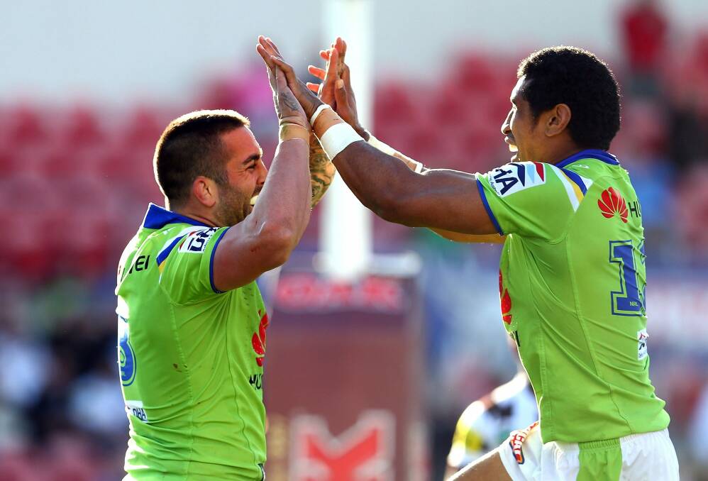 Raiders forwards Paul Vaughan and Sia Soliola celebrate last Sunday's 34-24 win in Penrith. The Raiders have the third-best away record in the NRL this season. Photo: Getty Images