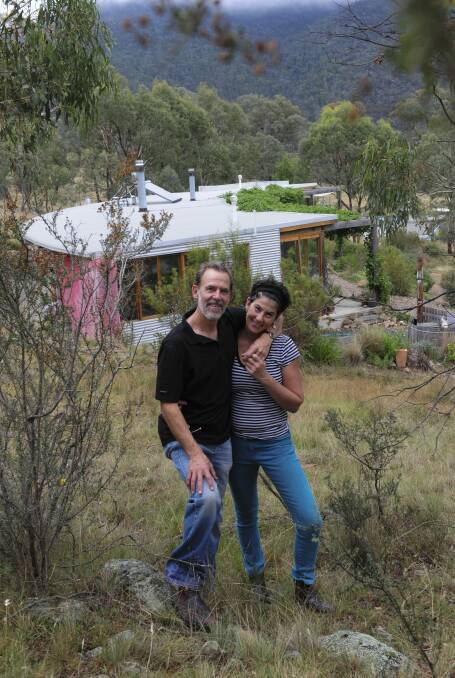  John Schneider and Jill Dobkin at their rural property. Ten years ago they had a straw bale home built on their land which is off the grid and totally self sufficient.
 Photo: Graham Tidy