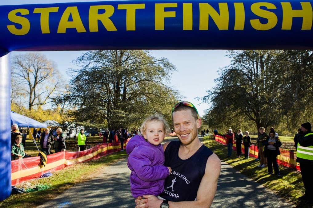 Chris Erickson, with his three-year-old daughter Anika, came first in the Lake Burley Griffin walking carnival. Photo: Jamila Toderas