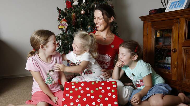 Samantha Murray with daughters Emily, 6, left, Zara, 2, and Lauren 4, at their Gungahlin home. Photo: Jeffrey Chan