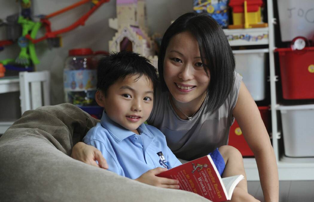 Jovern Loh, 5, pictured with his mother Li San Loh, will start kinder with the same speech and language skills as his peers, despite being born with hearing loss. Photo: Graham Tidy