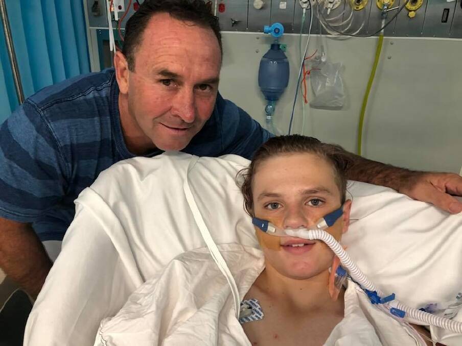 Canberra Raiders' coach Ricky Stuart visits 13-year-old accident victim Thomas "TJ" Campagna at Canberra Hospital on Christmas morning. Photo: Facebook