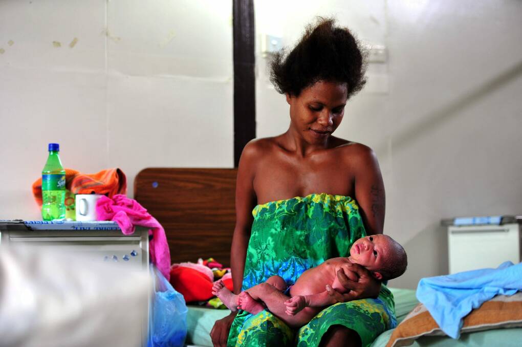 A new mother and her baby in Port Moresby.  Photo: Karleen Minney