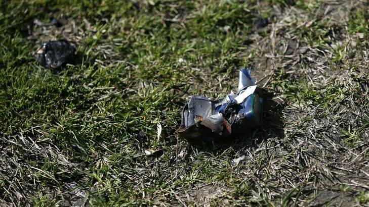 The remains of a can that was exploded  in front of St Clare of Assisi Primary School in Conder. Photo: Jeffrey Chan