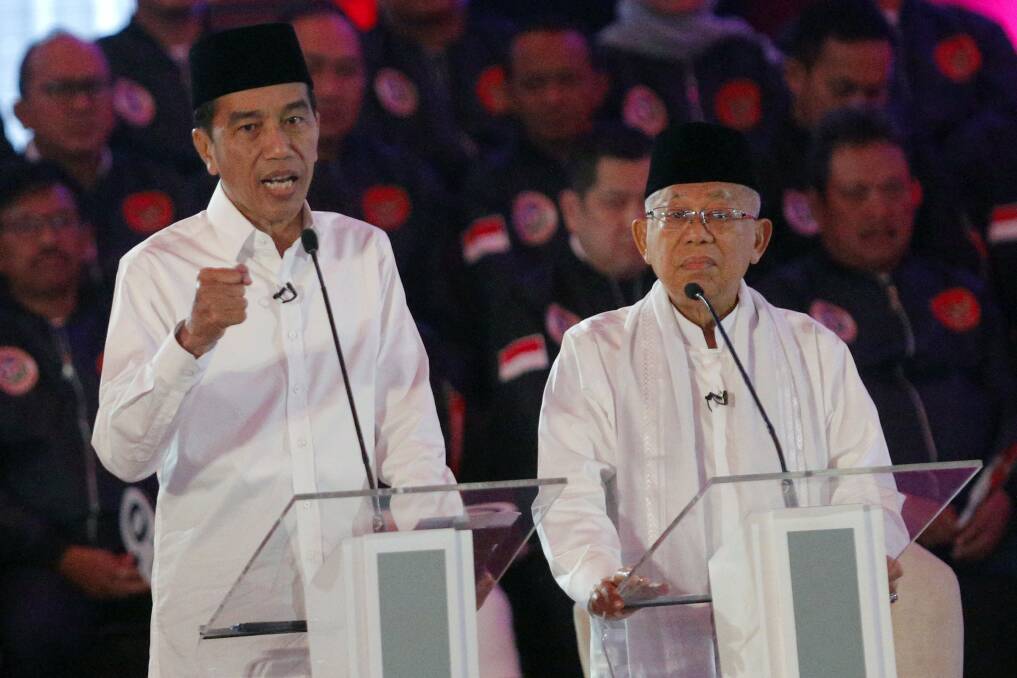 Indonesian President Joko Widodo and his running mate Ma'ruf Amin during the televised debate in Jakarta on Thursday night. Photo: AP