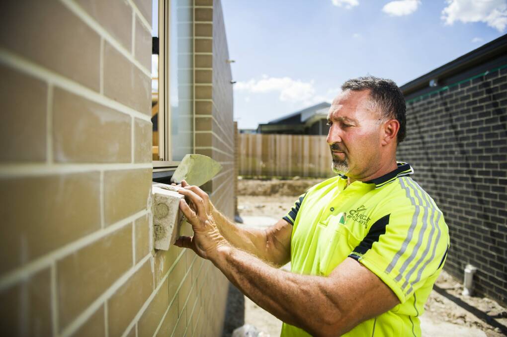 Chris Gianchou lays some of the final bricks for a home in Casey.
 Photo: Photo by Rohan Thomson