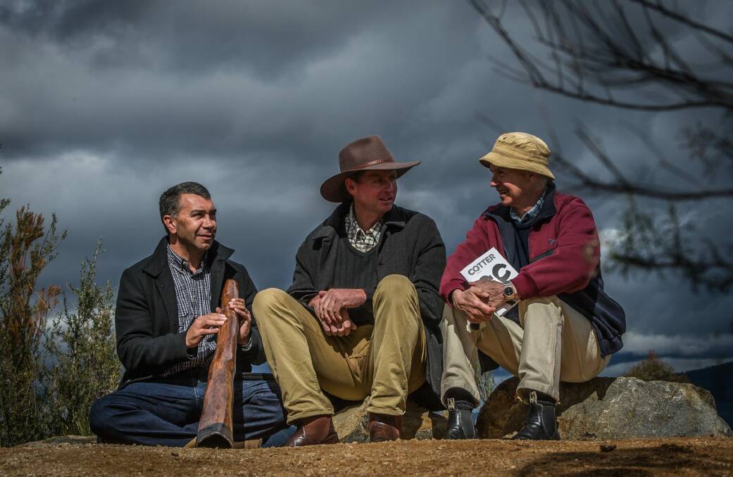 Descendants of the main characters in the novel (from left) the great-great-great-grandson of Onyong, Paul House, and the great-great-grandson of Garrett Cotter, Liam Cotter and author Richard Begbie overlook the Cotter area from Mt Macdonald. Photo: Karleen Minney