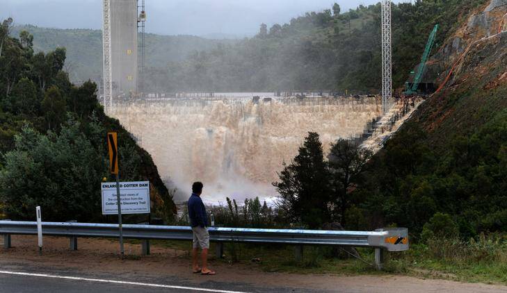 The Cotter Dam overflowing on Friday. Photo: Richard Briggs
