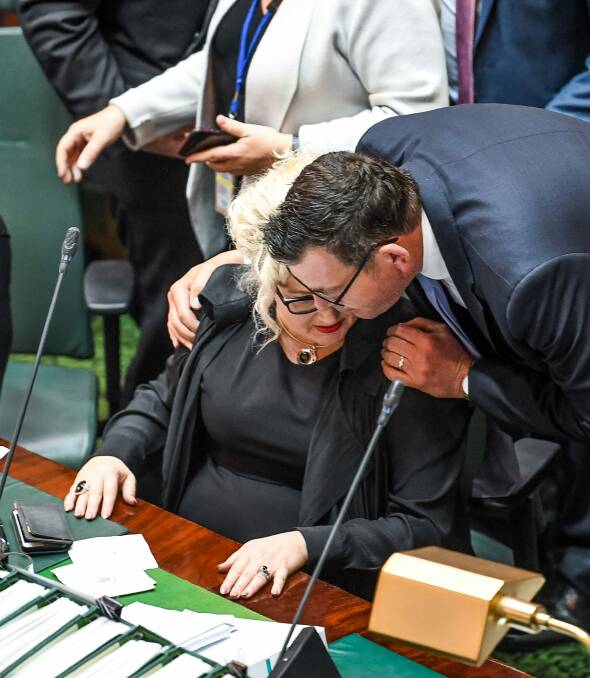 Premier Daniel Andrews embraces health minister Jill Hennessy after the vote after a marathon debating session. Photo: Justin McManus
