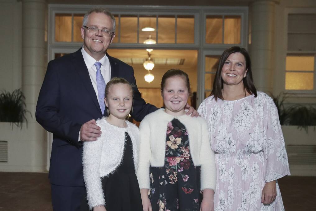 Prime Minister Scott Morrison with his wife Jenny and daughters Abigail and Lily pose for photos after being sworn-in at Government House in Canberra on Friday. Photo: Alex Ellinghausen