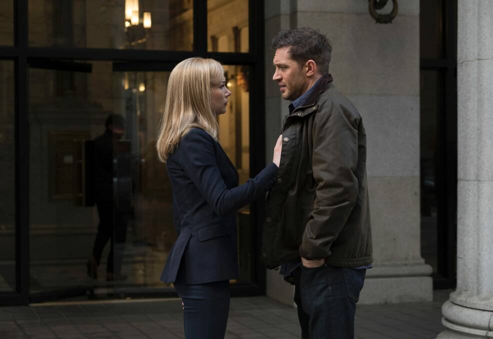 This image released by Sony Pictures shows Michelle Williams, left, and Tom Hardy in a scene from "Venom." (Frank Masi/Sony Pictures via AP) Photo: AP