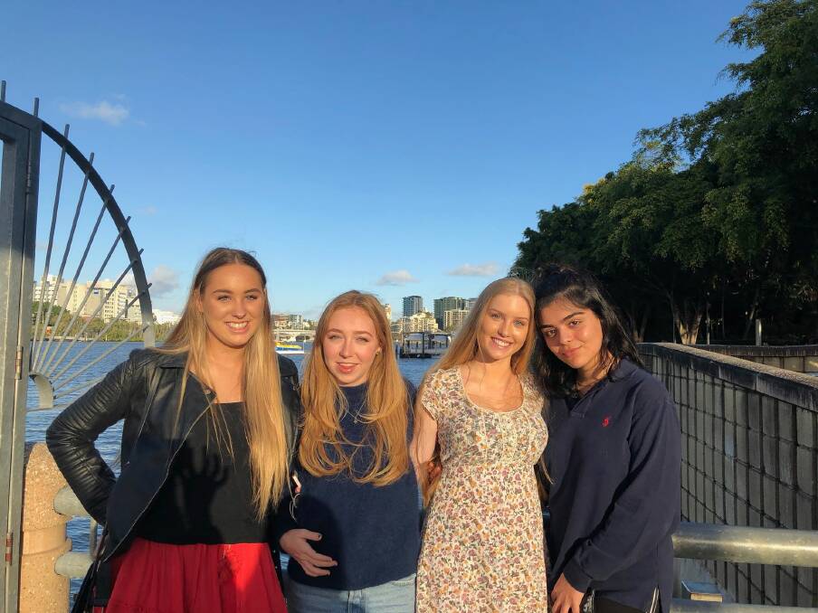 Friends and four of the co-organisers: of tonight\'s walk (left to right): Gabi Wernham, Zoe Stuart, Krystal Cotterell and Bella Beiraghi. The other co-organisers Emra Stuck and Aspen Roggeveen are missing from the photo. Photo: Bella Beiraghi