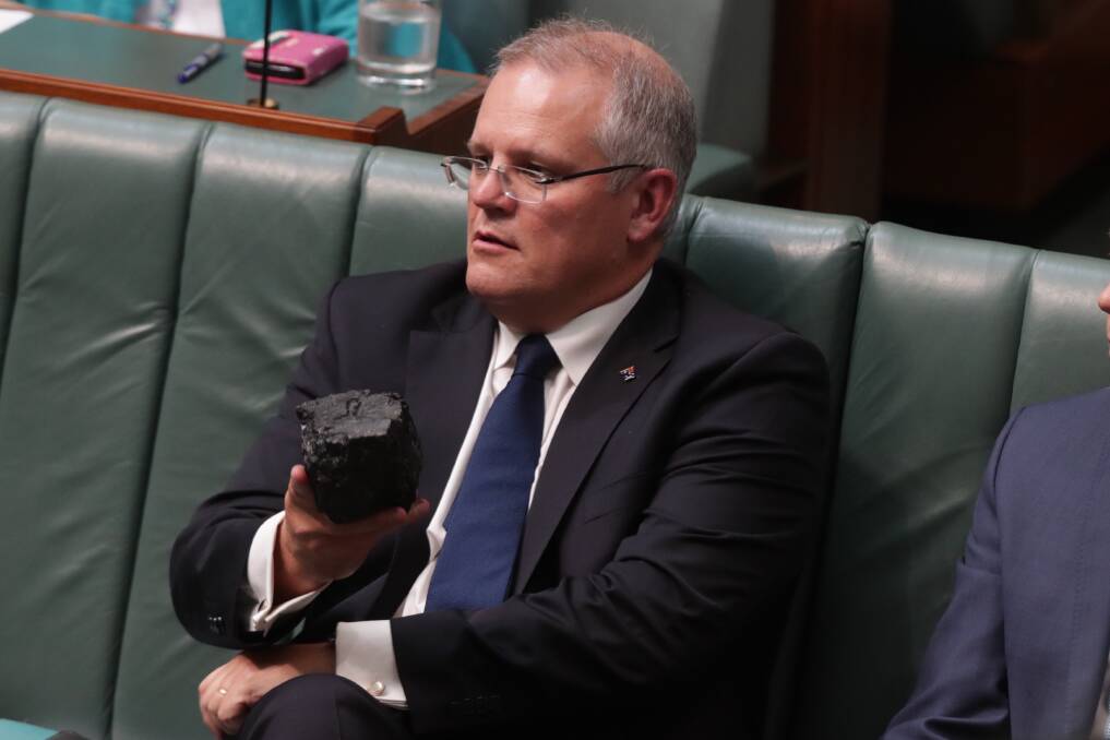 Scott Morrison with the lump of coal he brought into Parliament. Photo: Andrew Meares