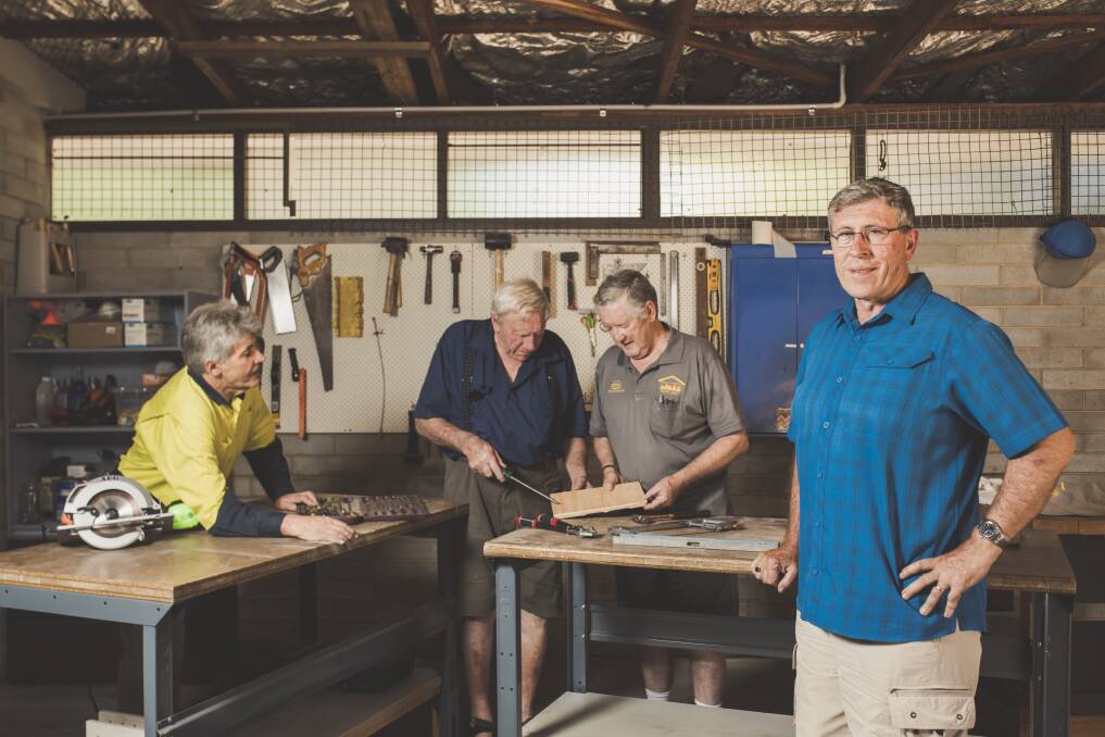 Workshop manager Allan Booth, committee member Graeme Ireland, vice president Bryan Blackburn, and (front) president Graham Lacey  at the new Men's Shed facilities at Weston Creek.  Photo: Jamila Toderas