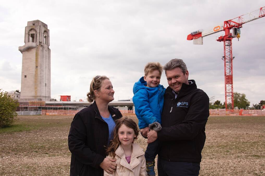 Canberra couple Caroline and Wade Bartlett with their children Alexa and Samuel on site this week at of the Sir John monash Centre  near Villers-Bretonneux in France. The couple are managing the project on behalf of the Department of Veteran Affairs. The existing Australian National Memorial rises above the new construction. Photo: Supplied