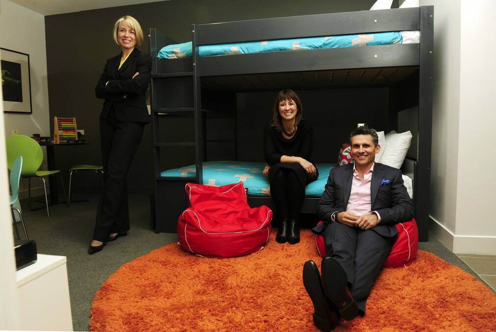 In the  kids cubby room, from left, are chair of the Canberra Hospital Foundation Deborah Rolfe and East Hotel owners Dion Bisa and Dan Bisa.  Photo: Melissa Adams 