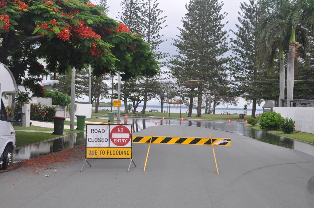 A road closed at Second Avenue and Reef Point Esplanade, Scarborough during a king tide on January 2, 2018. Photo: Graham Davis 