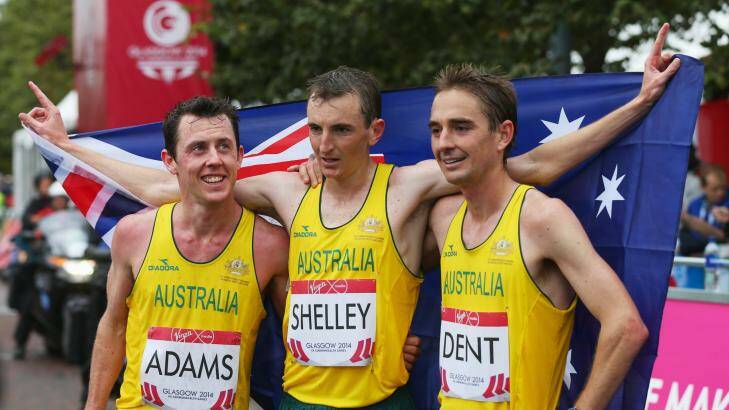 Michael Shelley, centre, celebrates his gold medal with Australian teammates Liam Adams, left, and Martin Dent, right. Photo: Getty Images