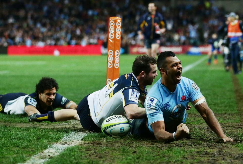 Kurtley Beale scores in the Waratahs' win against the Brumbies last year. Photo: Getty Images