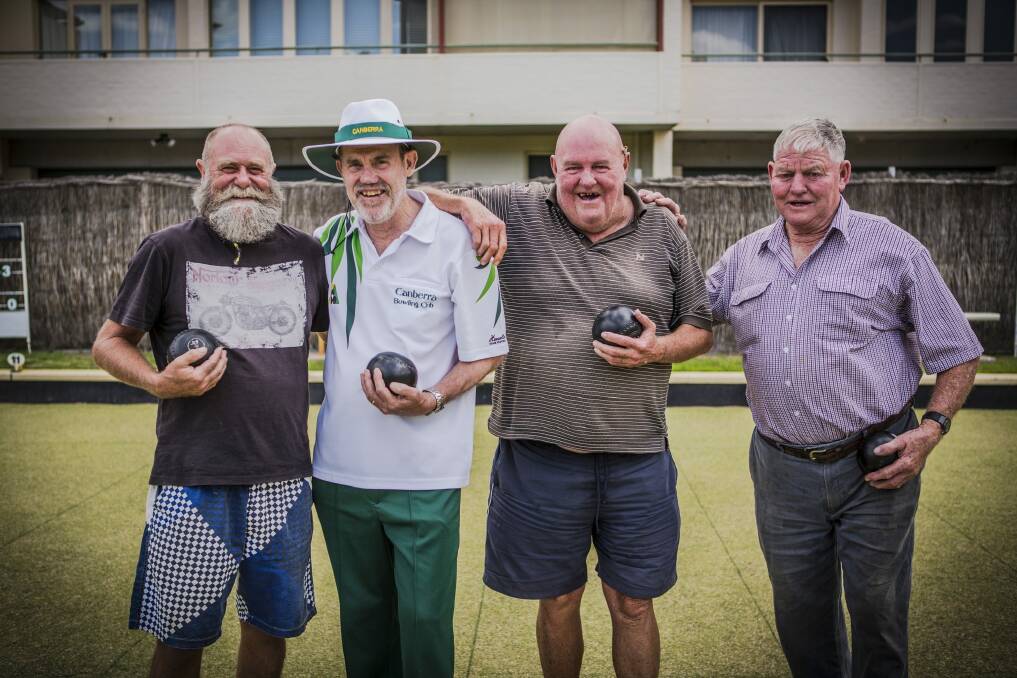 Canberra Bowling Club members (from left) Allan Morgan, president David Kimber, Greg Pickup and Mike O'Brien enjoy a laugh on the green. Photo: Jamila Toderas