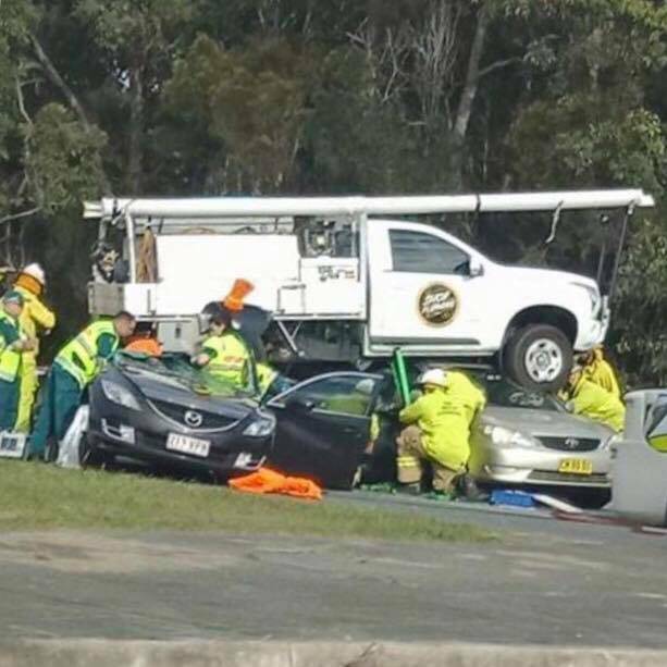 The ute landed on cars on Pumicestone Road after coming down the off-ramp alongside the Caboolture Bypass. Photo: Facebook / Moreton Alert
