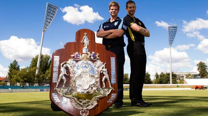 NSW captain Steve Smith (left) and WA captain Adam Voges with the Sheffield Shield. Photo: Mark Nolan