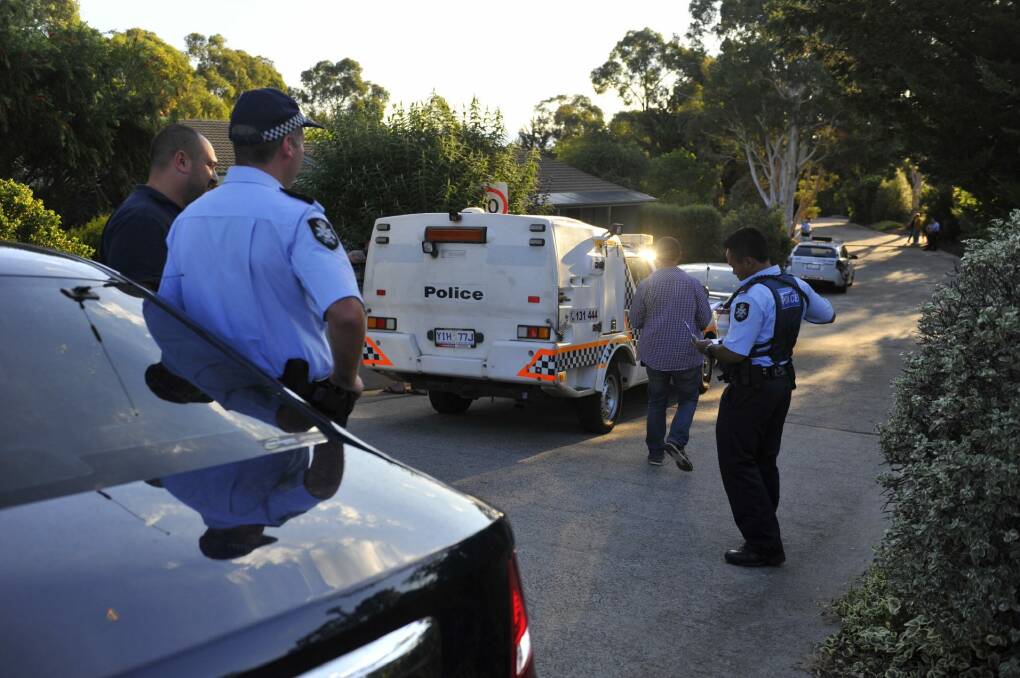 Police investigate the death of a woman at a Calwell home on Saturday. Photo: Jay Cronan