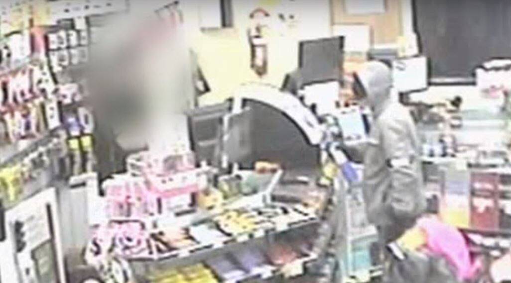 CCTV stills of a man using a propane blow-torch to rob the Woolworths Petrol station in Conder. Photo: ACT Policing