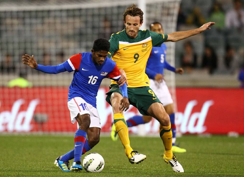 The Socceroos' Josh Kennedy in action against Malaysia at Canberra Stadium in 2011. The Socceroos could be returning to Canberra for their World Cup qualifiers.