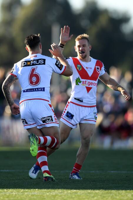 Puff they go: Gareth Widdop and Matt Dufty celebrate on their way to a tough win in Mudgee. Photo: AAP