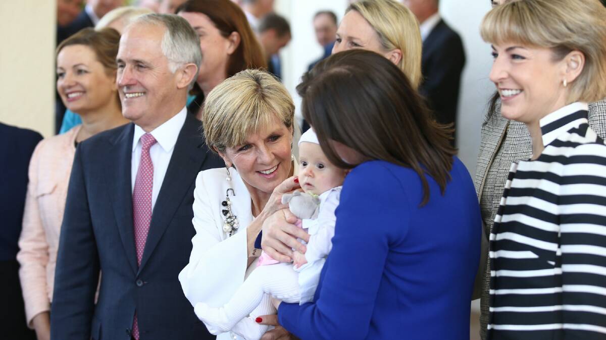 Prime Minister Malcolm Turnbull with female members of his new-look frontbench. Photo: Andrew Meares
