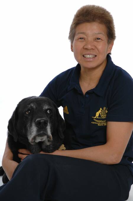 Paralympic medalist Lindy Hou with her guide dog Harper. Photo: act\supplied