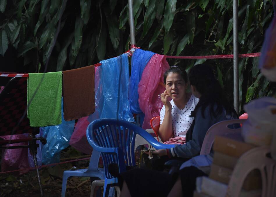 Relatives of the trapped boys await their rescue at the base camp near Tham Luang cave.  Photo: Kate Geraghty